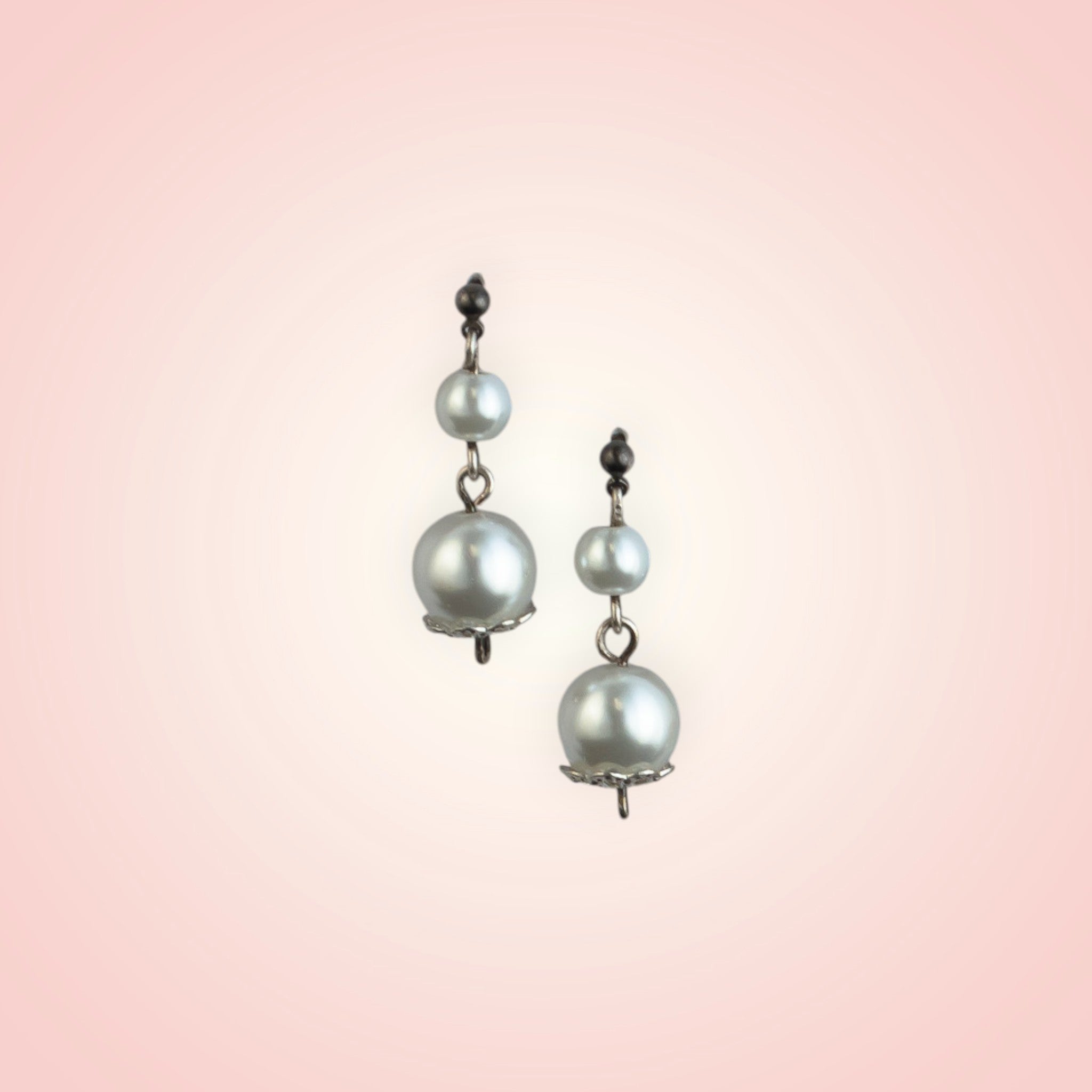 Earrings with two dangling pearls