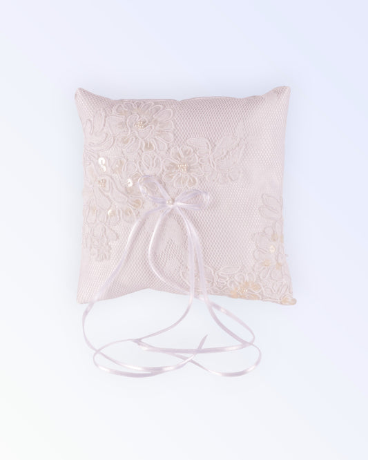 White satin lace-covered ring pillow