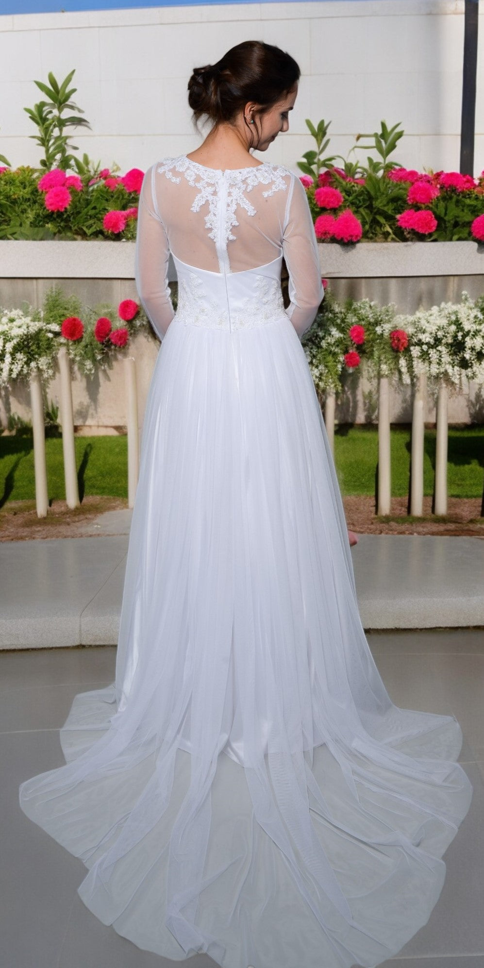 White tulle wedding dress with train