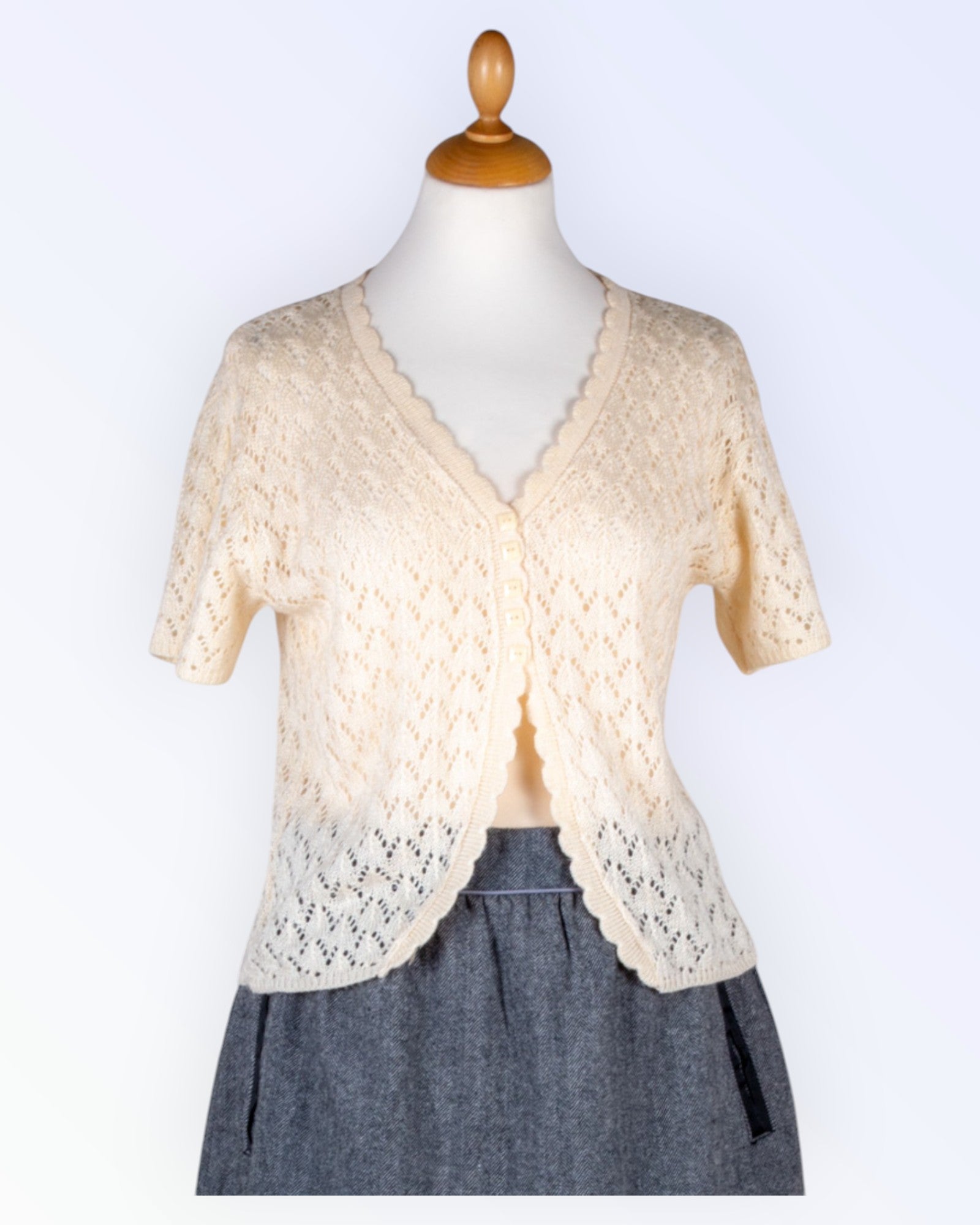 Kootud pitsist kardigan