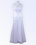 White mermaid-style wedding dress with a train