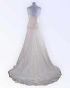 Off-white wedding dress with long train