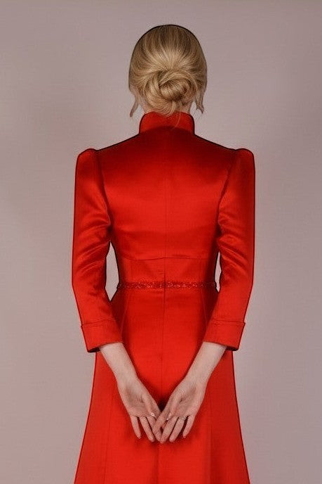 Ageless.ee red satin evening gown with bolero jacket, high neckline, and beaded waist detail.