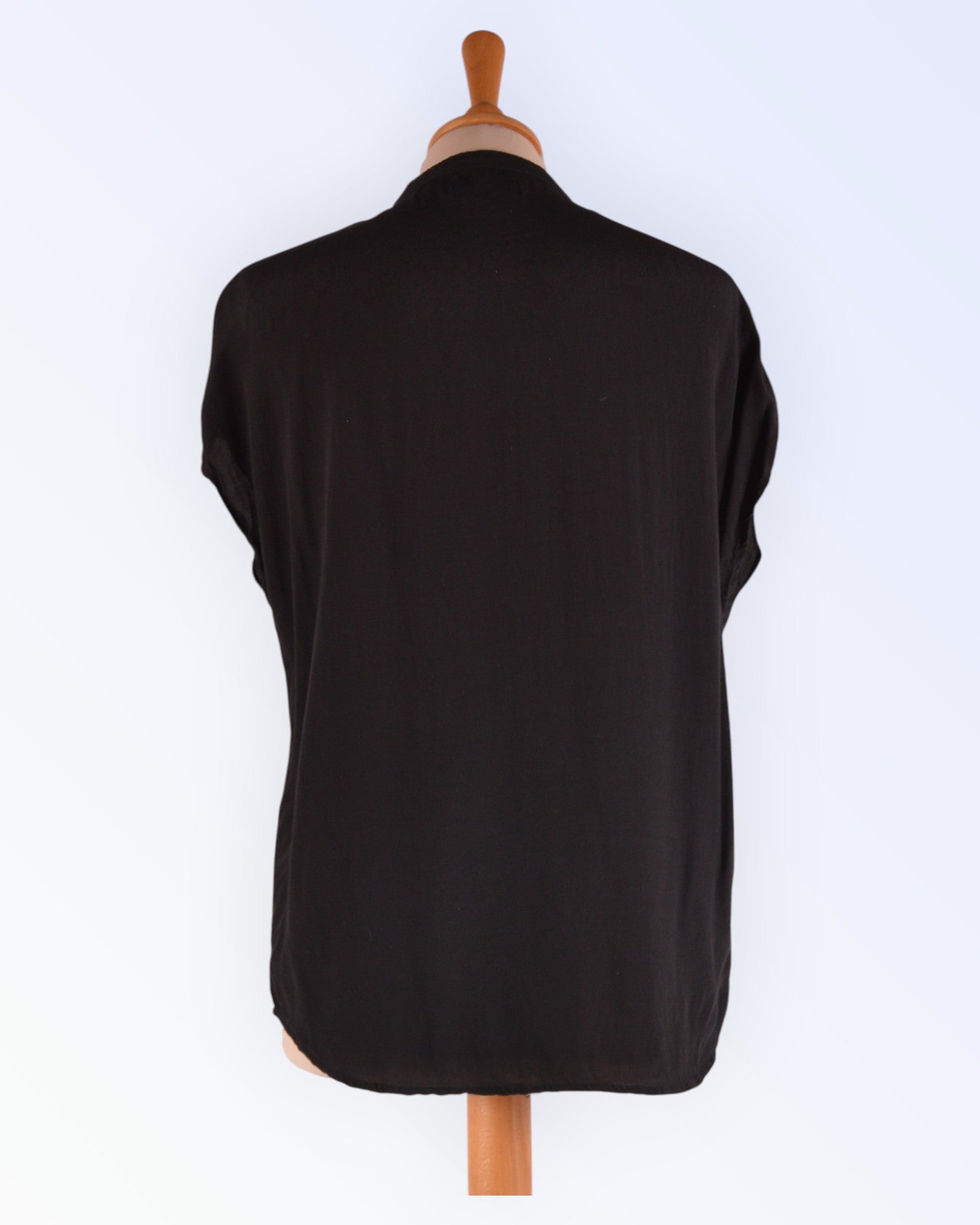 Soaked in Luxury black loose-fitting summer blouse