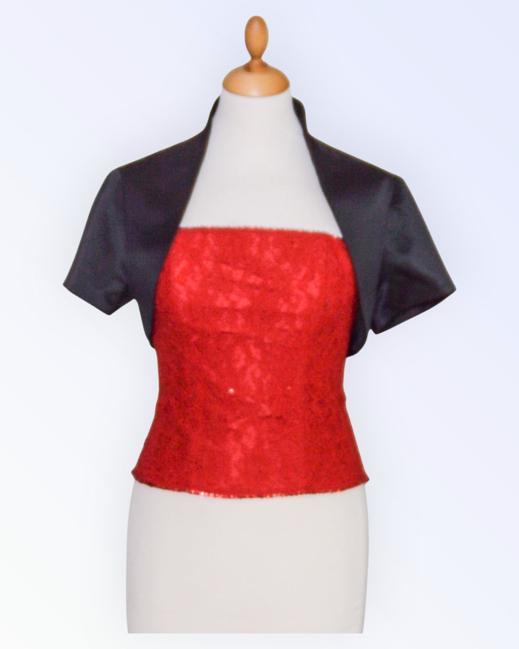 Mustast satiinist boolero