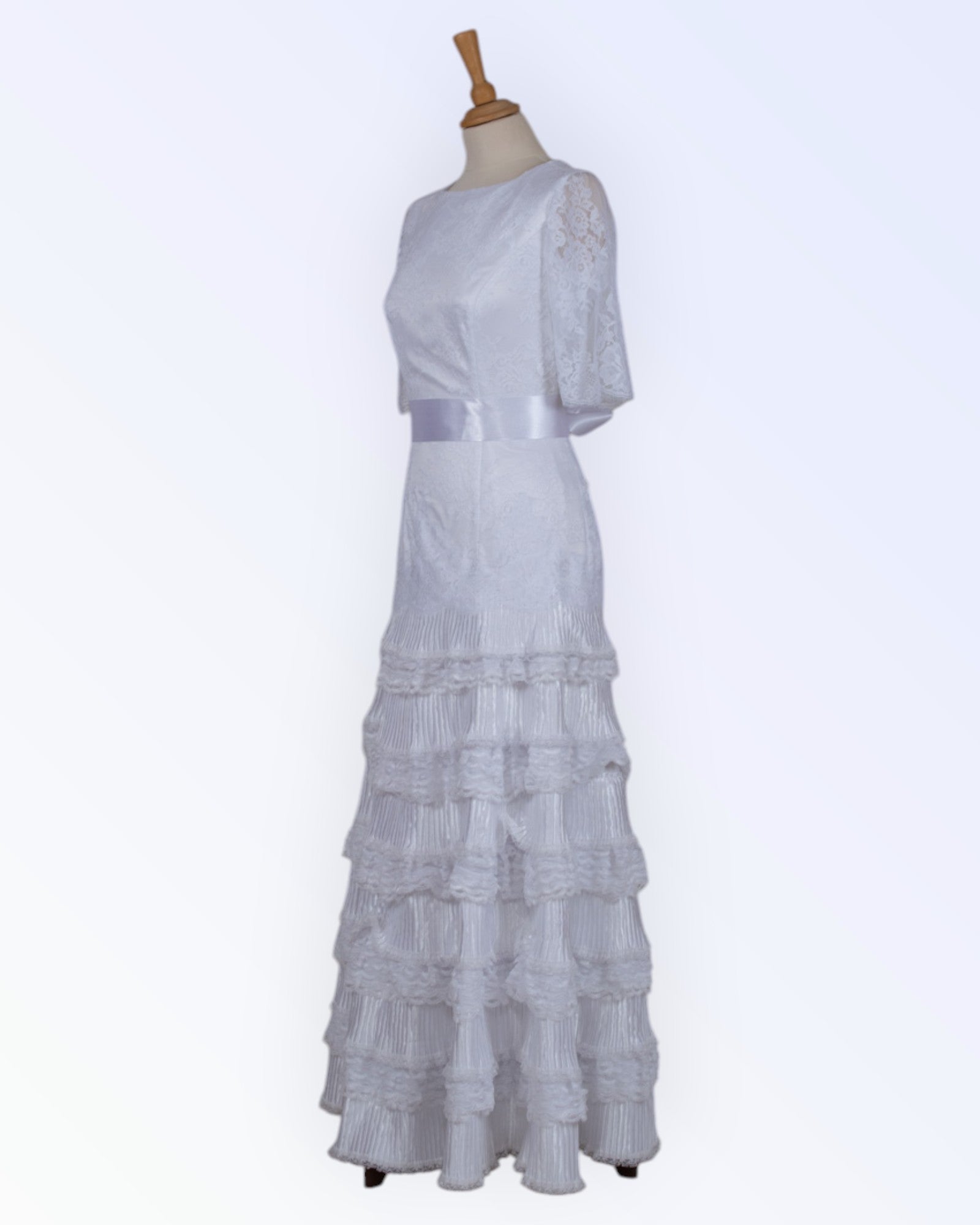 Wedding dress with ruffled skirt